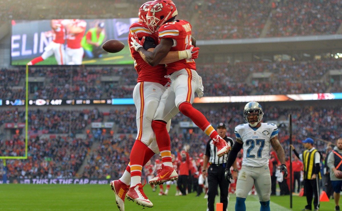 Nov 1, 2015; London, United Kingdom; Kansas City Chiefs running back De'Anthony Thomas (28) celebrates with tight end Brian Parker (82) after scoring on a 10-yard touchdown run in the first quart ...