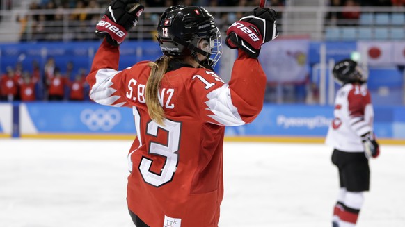 Sara Benz (13), of Switzerland, celebrates after scoring a goal against Japan during the second period of the preliminary round of the women&#039;s hockey game at the 2018 Winter Olympics in Gangneung ...