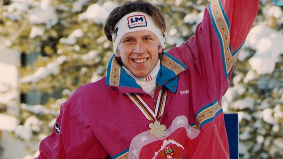 DOWNHILL MEDALIST: Downhill Gold medalist Hansjoerg Tauscher, of West Germany, rides the shoulders Switzerlands second place finisher Peter Mueller (left) and Karl Alpinger at the World Alpine Champio ...