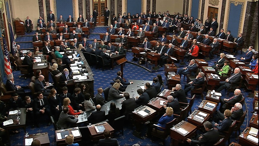 In this image from video, Sen. Mitt Romney, R-Utah, back row second from left, stands and cast a &#039;guilty&#039; vote on the first article of impeachment, abuse of power, during the impeachment tri ...