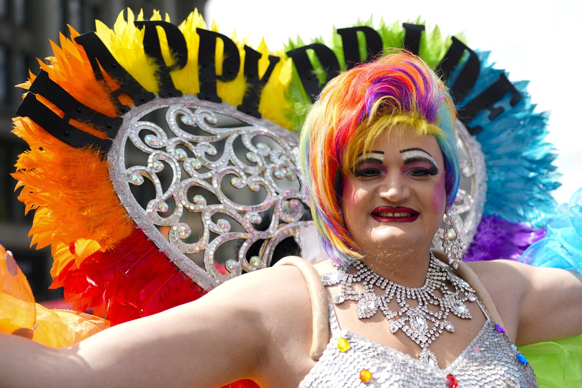 A reveler attends the annual pride march in Berlin, Germany, Saturday, July 23, 2022. Draped in rainbow flags, around 150,000 people were marching for LGBTQ rights at Berlin's annual Christopher  ...