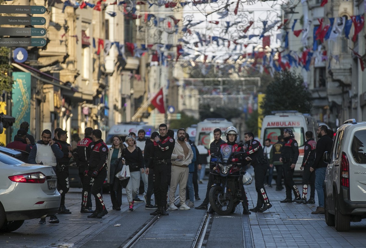 Security and ambulances at the scene after an explosion on Istanbul's popular pedestrian Istiklal Avenue, Sunday, Nov. 13, 2022. An explosion on one of Istanbul's most popular pedestrian tho ...