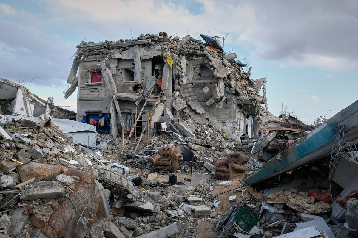 The half-collapsed home of the Halawa family stands in Jabaliya, Gaza City, Tuesday, Nov. 25, 2025. Amani and Mohammed Halawa and their children returned after the ceasefire to find rubble and a damag ...