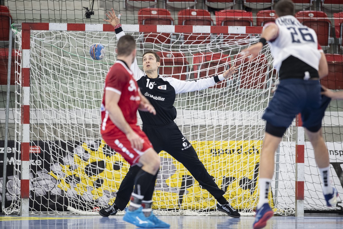 Switzerland's Nikola Portner, left, in action against Ukraine's Stanislav Zhukov, right, during the Yellow Cup Handball game between Switzerland and Ukraine in Switzerland, Winterthur, Frida ...