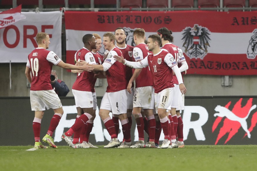 Austria&#039;s players celebrate a goal during the World Cup 2022 group F qualifying soccer match between Austria and Israel in Klagenfurt, Austria, Friday, Nov. 12, 2021. (AP Photo/Lisa Leutner)