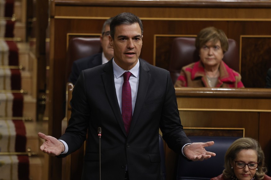 epa10338214 Spanish Prime Minister Pedro Sanchez during question time at the Lower House in Madrid, Spain, 30 November 2022, amid criticism against the 'Only yes is yes' law that came into force back  ...