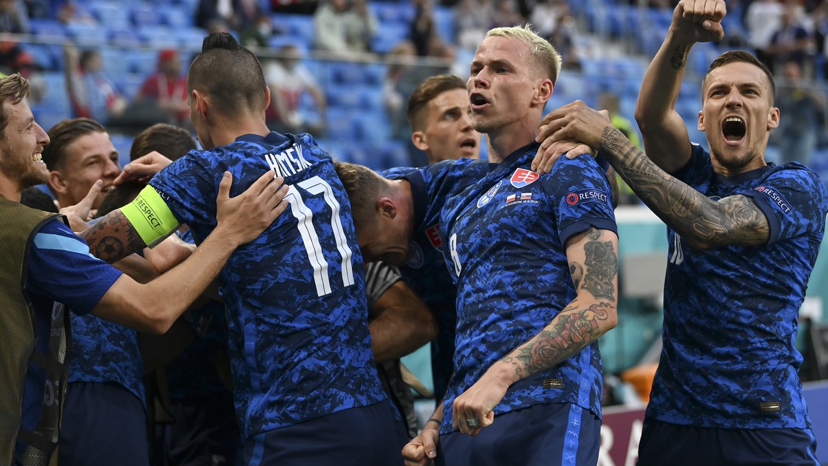 Slovakia's Milan Skriniar celebrates with teammates after scoring his side's second goal during the Euro 2020 soccer championship group E match between Poland v Slovakia at the Saint Petersb ...