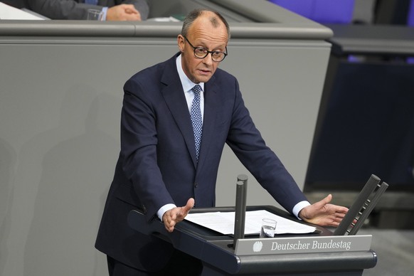 German opposition leader and Christian Union parties floor leader Friedrich Merz speaks at a debate about migration at the German parliament Bundestag in Berlin, Germany, Wednesday, Jan. 29, 2025. (AP ...