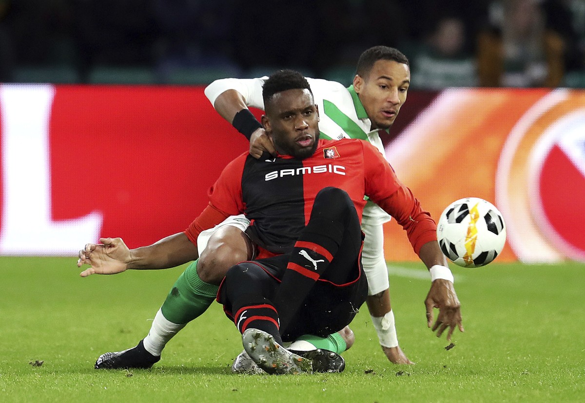 Celtic's Christopher Jullien, background and Rennes' Jordan Siebatcheu battle for the ball, during the Europa League Group E match between Celtic annd Rennes at Celtic Park, in Glasgow, Scot ...