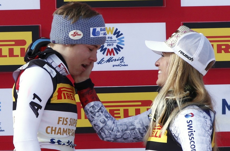 Alpine Skiing - FIS Alpine Skiing World Championships - Women&#039;s Super G - St. Moritz, Switzerland - 7/02/17 - Lara Gut of Switzerland wipes the tears of gold medalist Nicole Schmidhofer of Austri ...