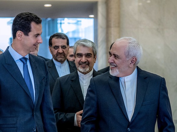 Der syrische Präsident Baschar al-Assad (l) und der iranische Aussenminister Mohammed Dschawad Sarif haben bei ihrem Treffen die kommende Woche anstehenden Gespräche in der kasachischen Hauptstadt Nur ...