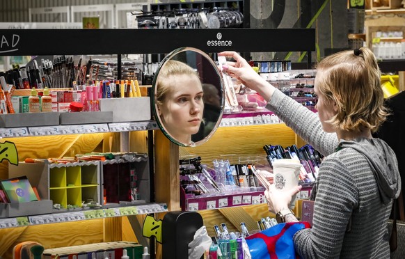 epa10992551 A Russian woman shops for Black Friday sales at the Afimall shopping center in Moscow, Russia, 24 November 2023. Each year, more shops in Russia join the Black Friday annual sales event. E ...
