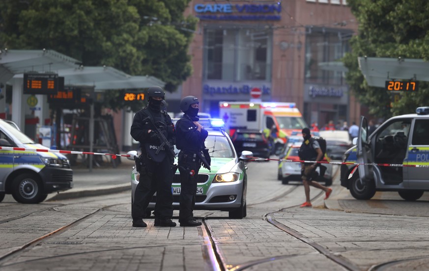 Police attend the scene of an incident in Wuerzburg, Germany, Friday June 25, 2021. German police say several people have been killed and others injured in a knife attack in the southern city of Wuerz ...