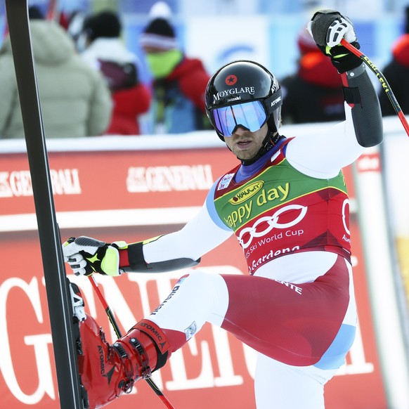 Switzerland's Mauro Caviezel arrives at the finish area during an alpine ski, men's World Cup super-G, in Val Gardena, Italy, Friday, Dec. 18, 2020. (AP Photo/Alessandro Trovati)