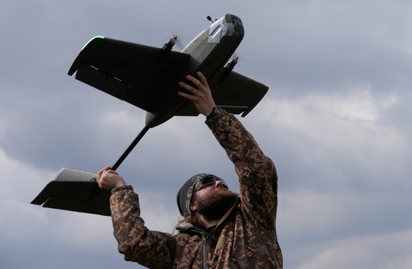 A student soldier of the Yatagan School for Unmanned Aerial Systems launches a training target drone during drills in the Kyiv region, Ukraine, Thursday, March 19, 2026. (AP Photo/Efrem Lukatsky)
Russ ...