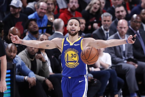 epa07583280 Golden State Warriors guard Steph Curry celebrates his team victory after the NBA Western Conference Playoff Finals game three between the Golden State Warriors and the Portland Trail Blaz ...