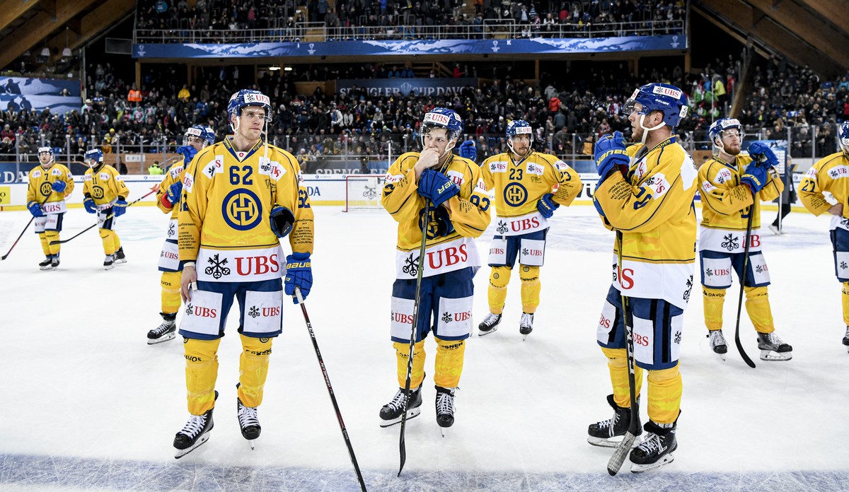 Davos' Felicien Du Bois, Davos' Yannick Frehner and Davos' Enzo Corvi after losing the game between TPS Turku and HC Davos, at the 93th Spengler Cup ice hockey tournament in Davos, Swit ...