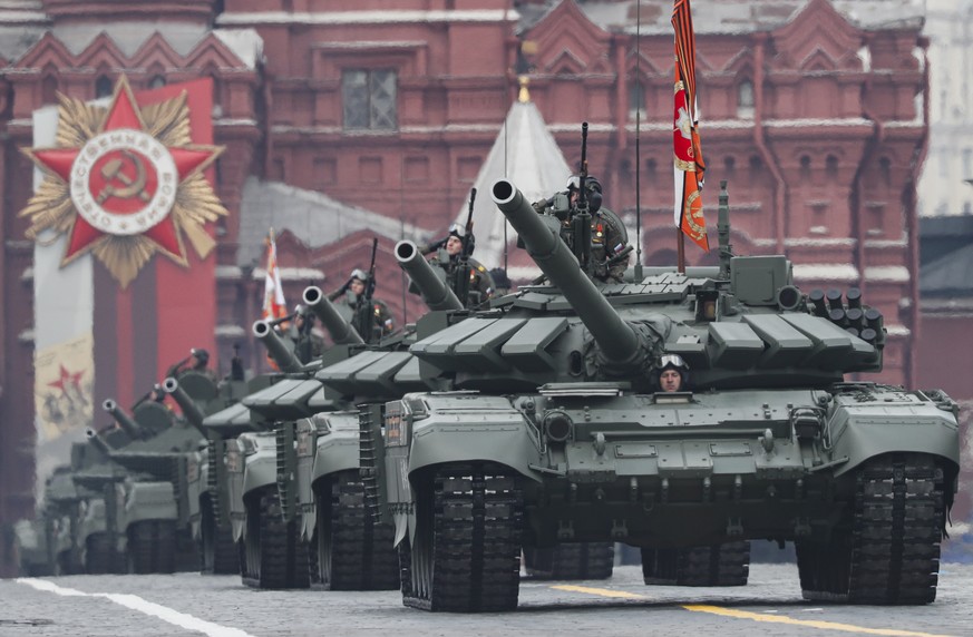epa09935239 Russian T-72B3M battle tanks roll through the Red Square during the Victory Day military parade in Moscow, Russia, 09 May 2022. The Victory Day military parade takes place annually to mark ...