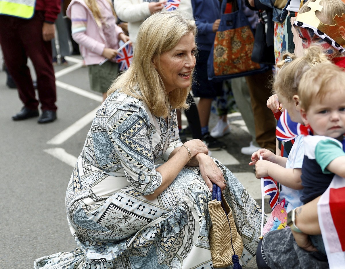 Britain's Sophie, the Duchess of Edinburgh greets people as she arrives to attend a Big Lunch with residents and representatives from the Royal British Legion, the Scouts and the Guides, in Cranl ...