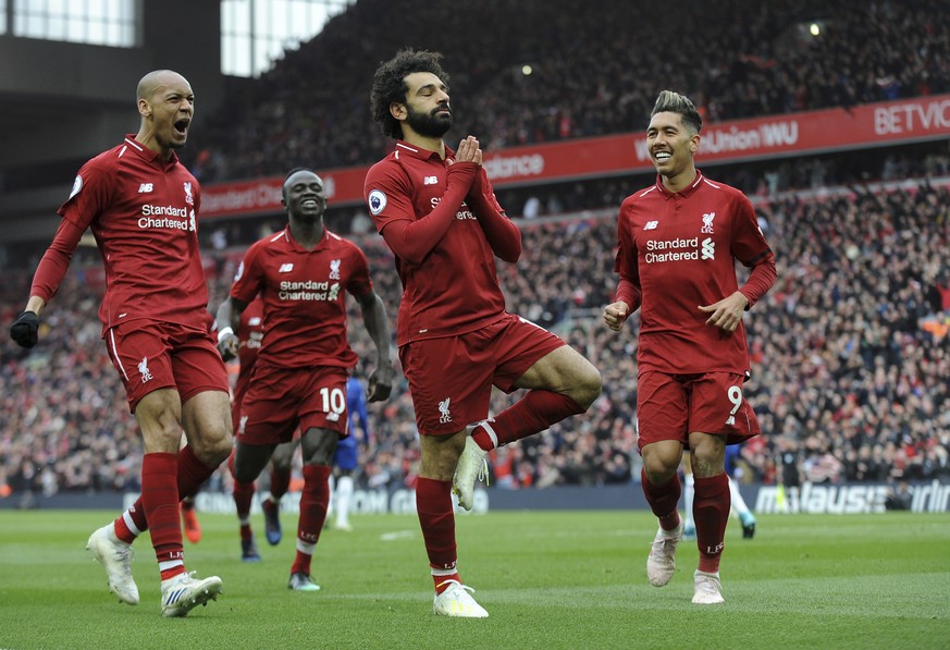 Liverpool&#039;s Mohamed Salah, center, celebrates with teammates after scoring his side&#039;s second goal during the English Premier League soccer match between Liverpool and Chelsea at Anfield stad ...