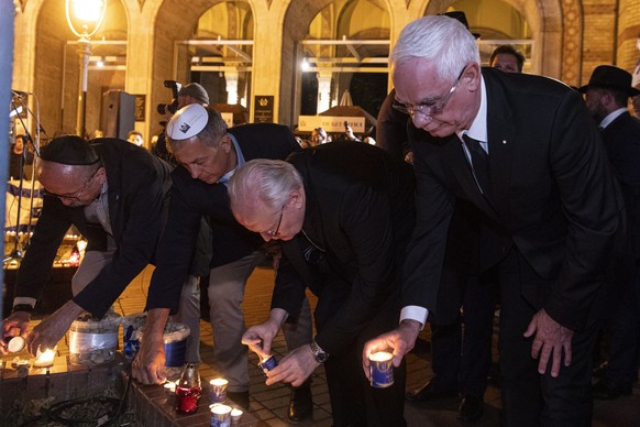 epa10914067 Mayor of the 7th District in Budapest Peter Niedermueller (L), Primate of the Hungarian Catholic Church, Archbishop of Esztergom-Budapest Cardinal Peter Erdo (2-R) and Bishop Zoltan Balog, ...