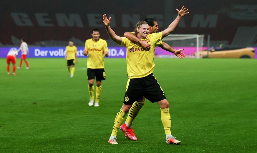 epa09198144 Dortmund&#039;s Erling Haaland (L) celebrates scoring the 4-1 lead with Dortmund&#039;s Emre Can (R) in action during the German DFB Cup final soccer match between RB Leipzig and Borussia  ...