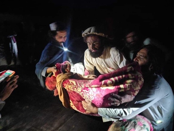 In this photo released by a state-run news agency Bakhtar, Afghans evacuate wounded in an earthquake in the province of Paktika, eastern Afghanistan, Wednesday, June 22, 2022. (Bakhtar News Agency via ...