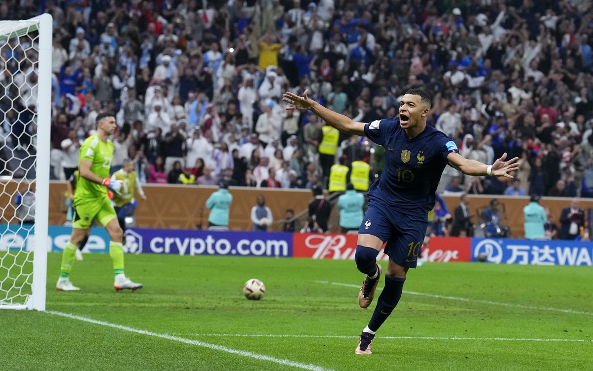 France's Kylian Mbappe celebrates scoring from the penalty spot his side's third goal during the World Cup final soccer match between Argentina and France at the Lusail Stadium in Lusail, Qa ...