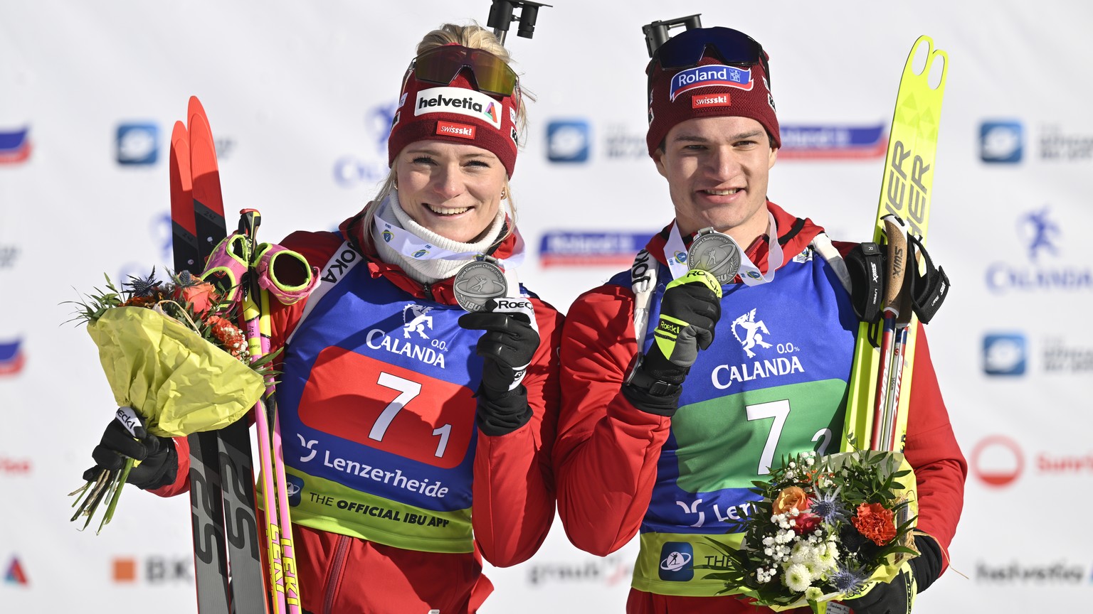 Silver medalistws Amy Baserga of Switzerland and Niklas Hartweg pose after the single mixed relay race at the IBU European Open Biathlon Championships, on Sunday, January 29, 2023, in Lenzerheide, Swi ...