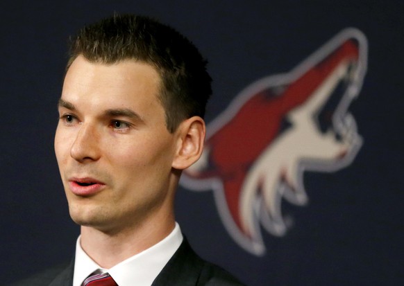 FILE - In this May 5, 2016, file photo, Arizona Coyotes general manager John Chayka speaks at a news conference in Glendale, Ariz. Chayka turned interest in hockey analytics into a business. The succe ...