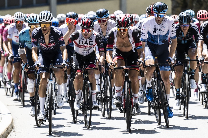 The peloton with Marc Hirschi from Switzerland of UAE Team Emirates, center, suffers in the heat during the fifth stage, a 193 km race from Ambri to Novazzano, at the 85th Tour de Suisse UCI ProTour c ...