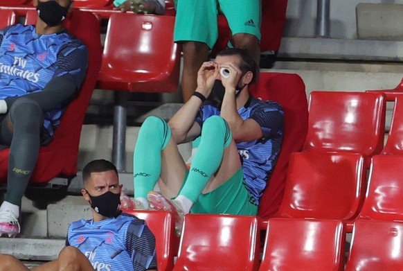 epa08544140 Real Madrid&#039;s winger Gareth Bale in the tribune ahead of the Spanish LaLiga soccer match between Granada CF and Real Madrid at Los Carmenes stadium in Granada, southern Spain, 13 July ...