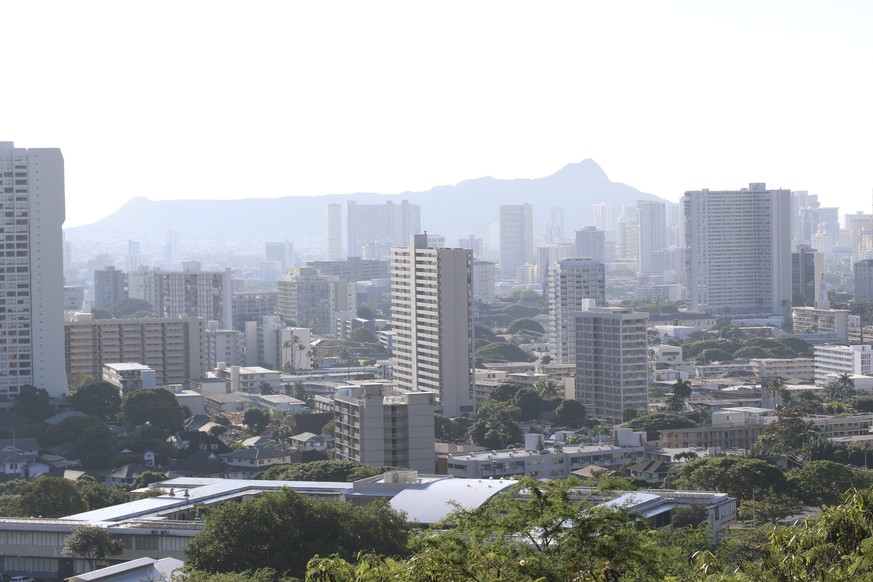 Diamond Head, an extinct volcanic crater, and high-rises are seen in Honolulu on Saturday, Jan. 13, 2018. A push alert that warned of an incoming ballistic missile to Hawaii and sent residents into a  ...