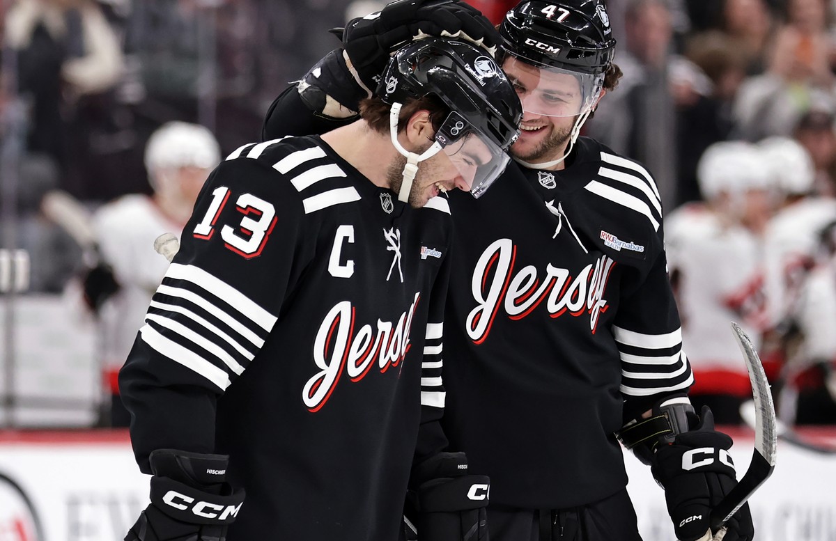 New Jersey Devils center Nico Hischier (13) celebrates after scoring the game winning goal in overtime with Paul Cotter (47) during an NHL hockey game against the Ottawa Senators, Sunday, April 12, 20 ...