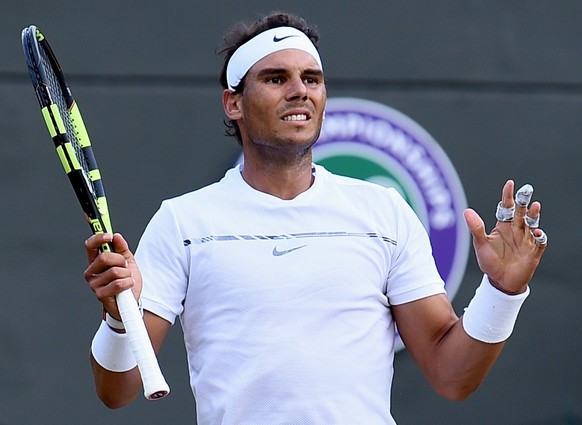 epa06079721 Rafael Nadal of Spain in action against Gilles Muller of Luxembourg during their fourth round match for the Wimbledon Championships at the All England Lawn Tennis Club, in London, Britain, ...