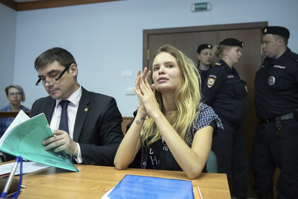 Veronika Nikulshina, center, a member of the feminist protest group Pussy Riot, attends hearings in a court in Moscow, Russia, Monday, July 23, 2018. Four members of the feminist protest group Pussy R ...