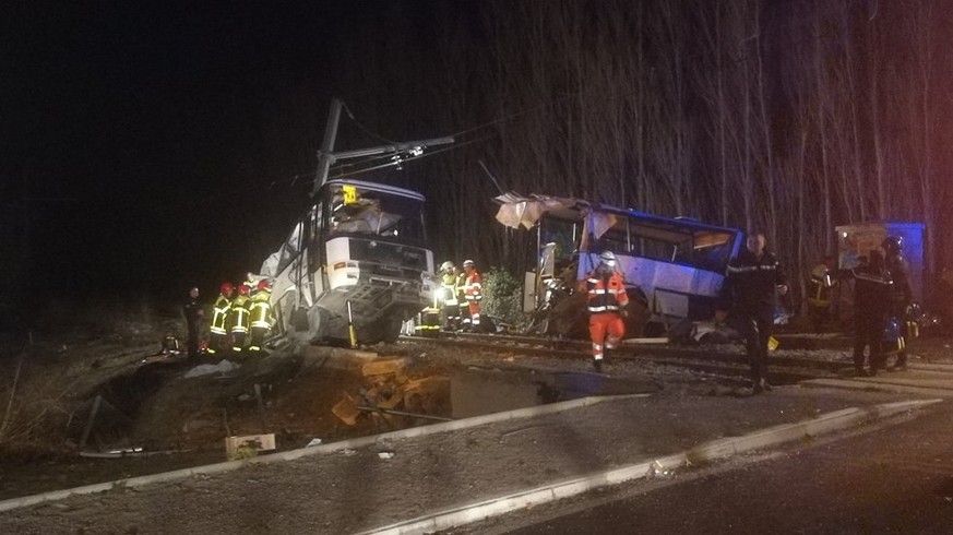 epa06390143 A handout photo made available by France Bleu Roussillon shows Emergency personnel at the crash site of a school bus with a train near Millas and Saint-Feliu-d&#039;Amont, Southern France, ...