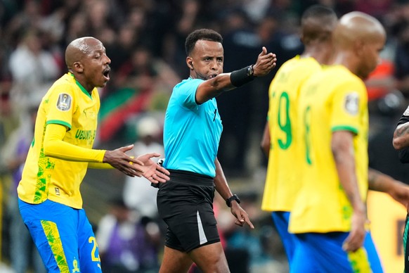 FILE - Referee Omar Artan, center, signals a penalty during the CAF Champions League final soccer match between AS FAR Rabat and Mamelodi Sundowns, in Rabat, Morocco, Sunday, May 24, 2026. (AP Photo/M ...