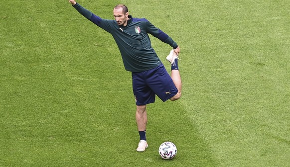 Italy&#039;s Giorgio Chiellini stretches during a training session ahead of Friday&#039;s Euro 2020 soccer championship round of 8 match against Belgium, at the Football Arena stadium in Munich, Germa ...