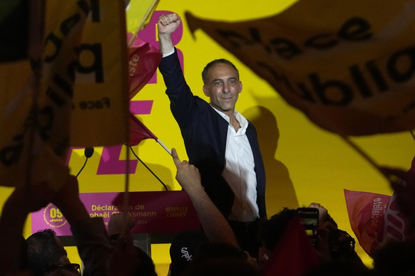 French Socialist Party lead candidate Raphael Glucksmann clenches his fist as he arrives on stage at the election night headquarters, Sunday, June 9, 2024 in Paris. First projected results from France ...