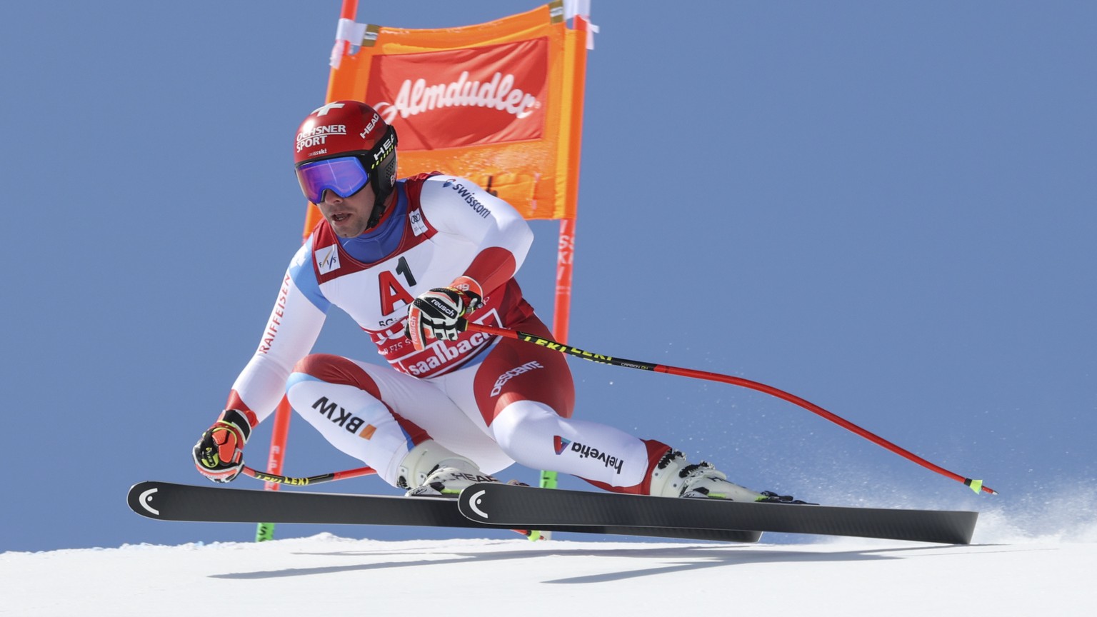 Switzerland&#039;s Beat Feuz speeds down the course during an alpine ski, men&#039;s World Cup downhill in Saalbach-Hinterglemm, Austria, Saturday, March 6, 2021. (AP Photo/Alessandro Trovati)