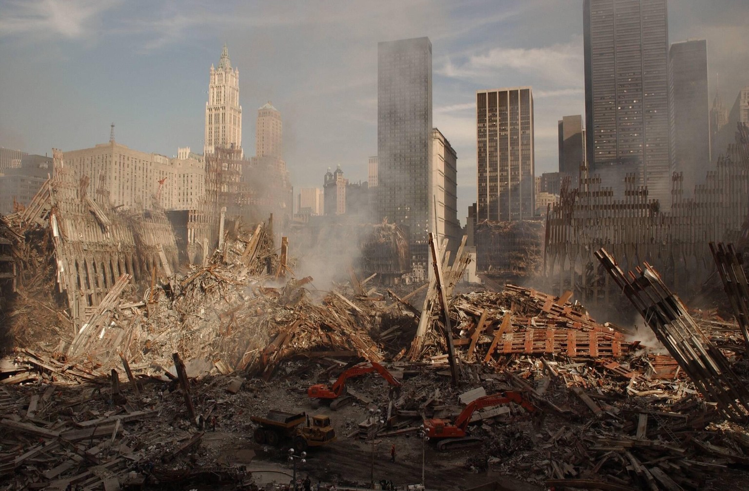 IMAGO / Everett Collection

Wide view of the ruins of the World Trade Center complex in New York City, Sept. 18, 2001. At left is the pile and facade arches of the North Tower, WTC 1. At right are tho ...