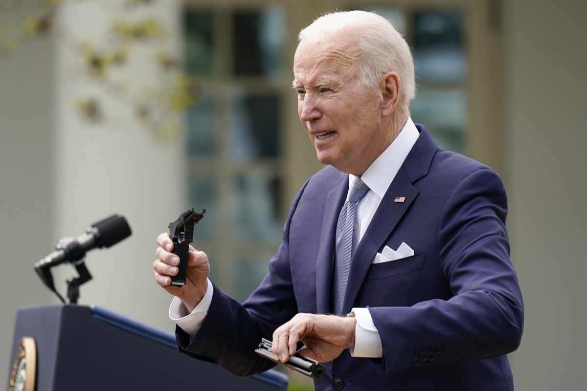President Joe Biden holds pieces of a 9mm pistol as he speaks in the Rose Garden of the White House in Washington, Monday, April 11, 2022. Biden announced a final version of the administration's  ...