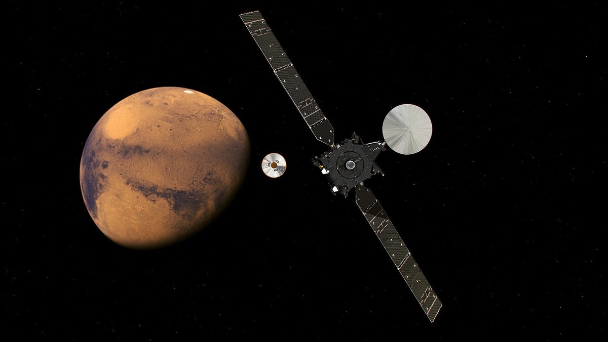 epa05585537 A handout image released on 19 February 2016 by the European Space Agency (ESA) shows an artist's impression of the ExoMars Trace Gas Orbiter (TGO) and its entry, descent and landing  ...