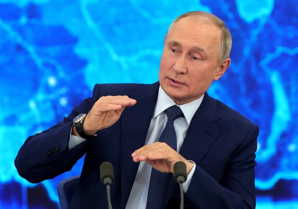 Russian President Vladimir Putin speaks via video call during a news conference in Moscow, Russia, Thursday, Dec. 17, 2020. This year, Putin attended his annual news conference online due to the coron ...