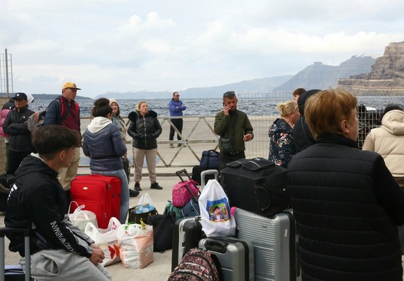 epa11874508 Residents and visitors wait to leave the island due to the increased seismic activity, at the port of Athinios in Santorini island, Greece, 04 February 2025. The municipality Thera (Santor ...