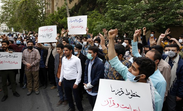 epa09896187 Iranian students chant slogans and hold placards during a protest against the burning of the Koran in Sweden, in front of the Swedish embassy in Tehran, Iran, 18 April 2022. Tens of Irania ...