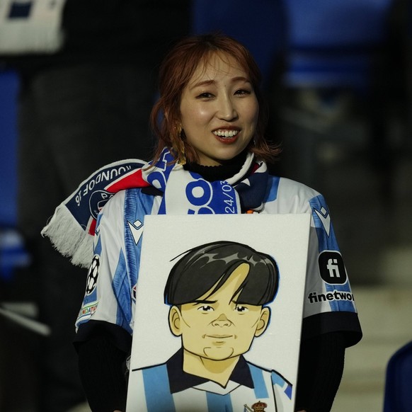 Real Sociedad v Paris Saint-Germain: Round of 16 Second Leg - UEFA Champions League 2023/24 Japanese fan of Takefusa Kubo with a portrait of him during the 2023/24 UEFA Champions League Round of 16 se ...