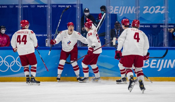 epa09745761 Team Russia celebrates scoring a goal during the Men's Ice Hockey preliminary round match between Denmark and Russia at the Beijing 2022 Olympic Games, Beijing, China, 11 February 202 ...