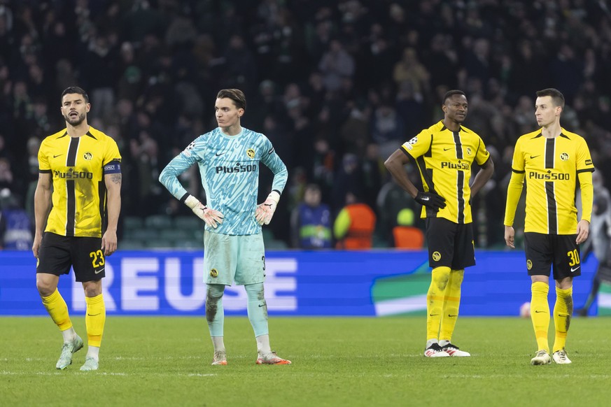 Loris Benito (YB), goalkeeper Marvin Keller (YB), Mohamed Ali Camara (YB) and Sandro Lauper (YB), from left, react after the Uefa Champions League soccer match between Scotland&#039;s Celtic Glasgow a ...
